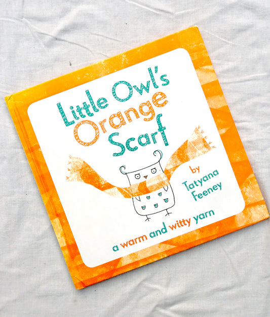 Little owl's orange scarf